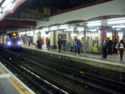 Looking across from one Metropolitan line platform to another with an arriving train