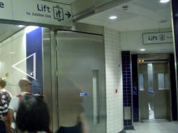 Lift and stairs to the Jubilee line from the lift interchange level (three photos automatically stitched together)