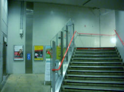 Lift (left) and stairs up to the DLR Stratford International branch platforms from the ticket hall level