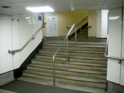 Stairs to the District and Circle line westbound platform from near the top of the escalator from the southbound Northern line platform