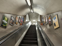 Looking up the escalator from the Northern line northbound to just below the District and Circle lines