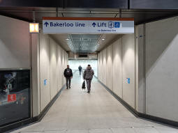 The start of the tunnel to the Bakerloo line from by the escalators, lift and stairs up to the Elizabeth line platforms
