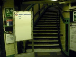 The bottom of the stairs from the ticket hall
