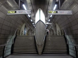 Looking up from between the platforms to the bottom of the escalators