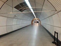 Looking towards the eastbound Elizabeth line platform and the central passage connecting with the exit to the Underground from the westbound platform