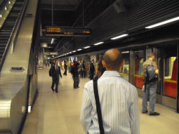 Slightly fuzzy picture showing the Eastbound platform with a train just arriving (June 2009)