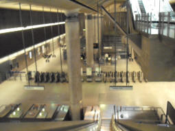 Taken from partly down the second set of escalators from the third entrance (which can be seen top-right), this fuzzy picture shows the main floor with the ticket barriers and escalators down to platform level in the middle (June 2009)
