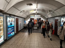 Escalators towards other platforms and the ways out from between the Northern line Bank branch and Victoria line northbound platforms