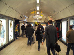 At the bottom of the escalators from the ticket hall. Northern line Charing Cross branch to the left, Northern line Bank branch and Victoria line to the left. The display in the middle shows the next three Northern line northbound trains on each platform