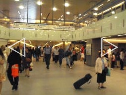 Auto-stitched panoramic photo of the St. Pancras ticket hall with the office windows and machines behind (June 2009)