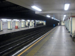 Looking along the District and Hammersmith & City line westbound platform, with the eastbound platforms for all lines on the left