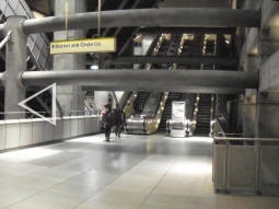 At eastbound Jubilee line level (you can just see the platform-edge doors near the left of the picture) we see the lift and the escalators to the District and Circle lines (multiple photos stitched together)