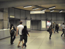 Fuzzy picture facing the accesses to the eastbound Jubilee line platform. Escalators up to the way out and District and Circle line platforms are behind the camera, escalators down to the westbound Jubilee line platform are off-camera to the right (June 2009)