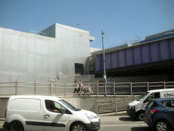The platform shelters can be made out at the end of the bridge